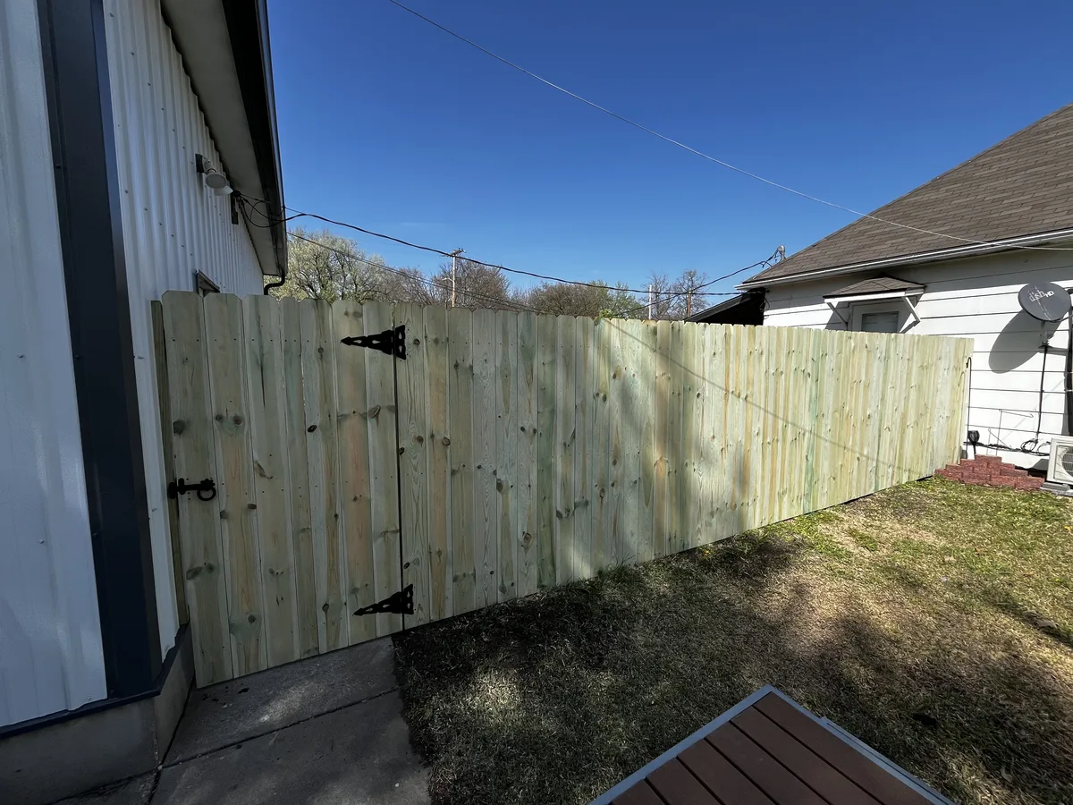 Wood privacy fence installation in Topeka, KS